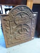 A cast iron fire back with C R Royal cip