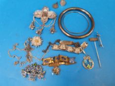 A hallmarked silver bangle, a silver bro