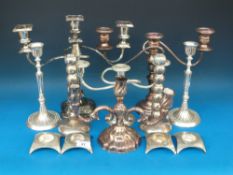 A quantity of various plated candelabra