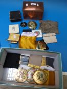 A collection of compacts including Strat