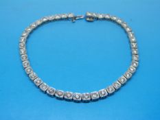 An 18ct white gold tennis bracelet set w
