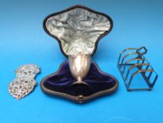 A cased hallmarked silver egg cup, a hal