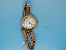 A 15ct gold watch with an enamel face on