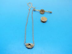 A yellow metal brooch marked 15ct, a hal