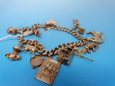 A yellow metal charm bracelet marked 9ct