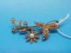 A yellow metal brooch marked 9ct set wit