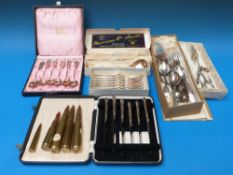 A cased set of white metal teaspoons mar