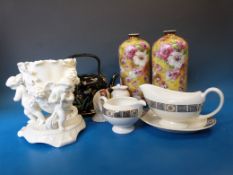 An enamelled Victorian ceramic teapot, a