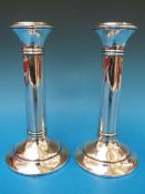 A pair of hallmarked silver candlesticks