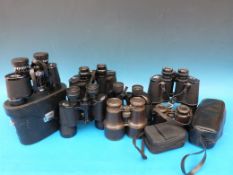 Nine various binoculars, some with cases