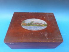 A wooden box with inner tray and hand-pa