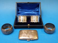 A cased pair of hallmarked silver napkin