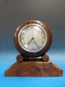 A small dial timepiece in mahogany case