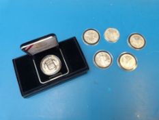 Five one ounce silver dollars together w