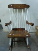 A painted Windsor style rocking chair