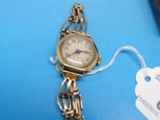 A 9ct gold ladies wristwatch on 9ct gold
