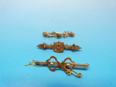 A hallmarked 9ct gold bar brooch set wit
