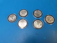 Six modern one ounce silver dollars