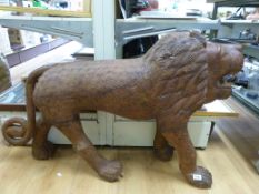 A large wooden model of a lion