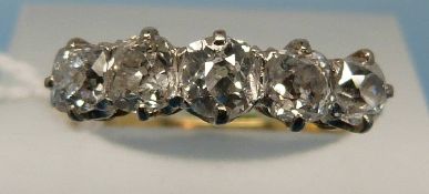 An 18ct gold ring set with five diamonds