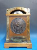 An oak Arts and Crafts mantel clock with