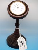 A turned wooden pocket watch stand toget