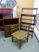 An Art Deco style oak tilt out magazine