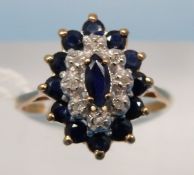 An 9ct gold ring set with a central marq