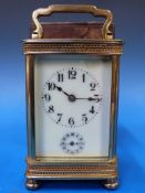 A French carriage clock with ivory colou