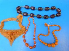 A collection of amber style necklaces
