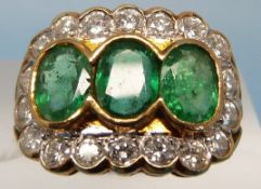 An 18ct gold ring set with three oval cu