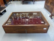 An oak table top display cabinet with lo
