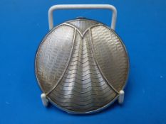 An Art Deco silver compact with circular