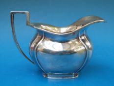 A hallmarked silver cream jug, Sheffield