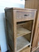 A rustic kitchen cupboard with single dr