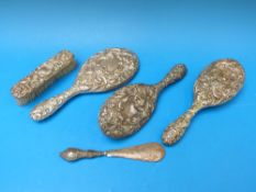 A hallmarked silver five piece embossed