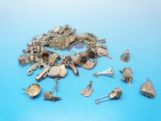 A silver charm bracelet with a large qua