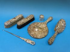 A hallmarked silver embossed dressing ta