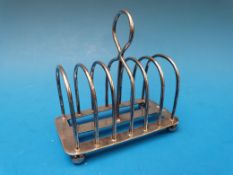 A hallmarked silver six slice toast rack