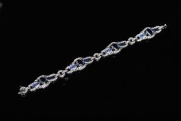 An 18ct white gold bracelet set with fou