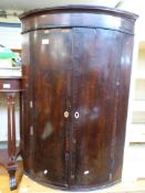 A Georgian mahogany barrel fronted corne