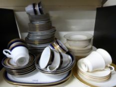 A quantity of blue & gilt dinner and tea