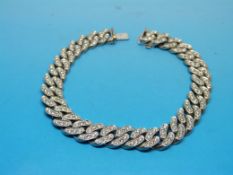 An 18ct white gold bracelet each link se