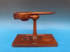 A wooden desktop press on stand, possibl