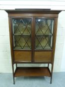 An inlaid Edwardian glazed display cabin