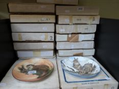 A collection of collector's plates in bo