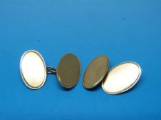 A pair of 9ct gold engine turned cufflin