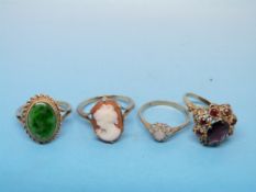 Four 9ct gold rings, variously set with
