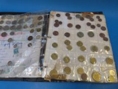 A black coin collector's album containin