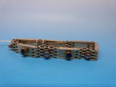 A 15ct gold gate bracelet set with three